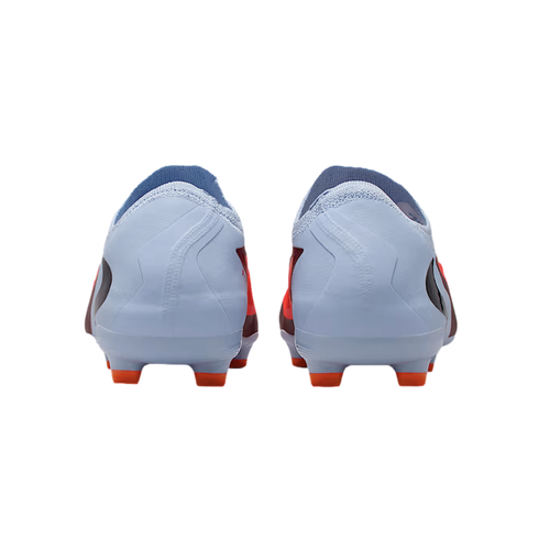 Rear view of a pair of light blue soccer cleats with bright orange studs, set against a solid black background.