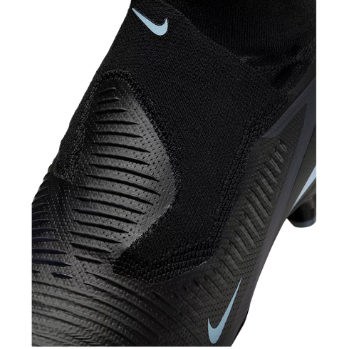 Close-up of a black Nike soccer cleat featuring a textured upper and light blue swoosh logos.