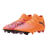 A pair of bright orange and pink Puma soccer cleats with black logos, displayed against a black background.