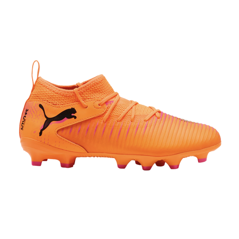 A bright orange Puma soccer cleat featuring pink accents, a textured upper, and a black leaping cat logo on a solid black background.
