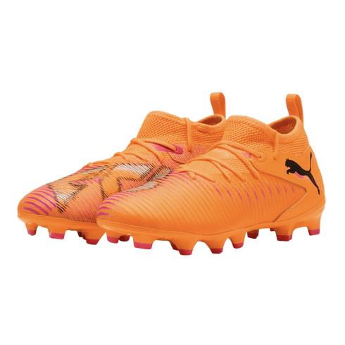 A pair of bright orange Puma soccer cleats featuring a textured upper with pink accents, a mid-cut knit collar, and a black Puma logo on the side.