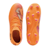 Top and bottom views of bright orange Puma soccer cleats with pink and black striped accents on the upper and pink studs on the soleplate.