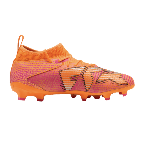 Vibrant orange and pink soccer cleat with a high ankle collar and textured upper shown in profile against a black background.