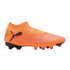 An orange Puma soccer cleat with a knitted collar, textured upper, and pink accents, shown in profile against a black background.