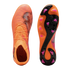 Top and bottom views of orange Puma soccer cleats featuring a textured upper and a pink-studded soleplate against a black background.