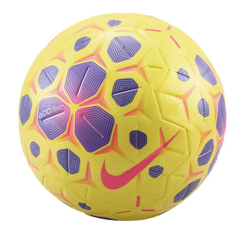 Yellow Nike soccer ball featuring purple and pink geometric patterns and a prominent pink swoosh logo against a black background.