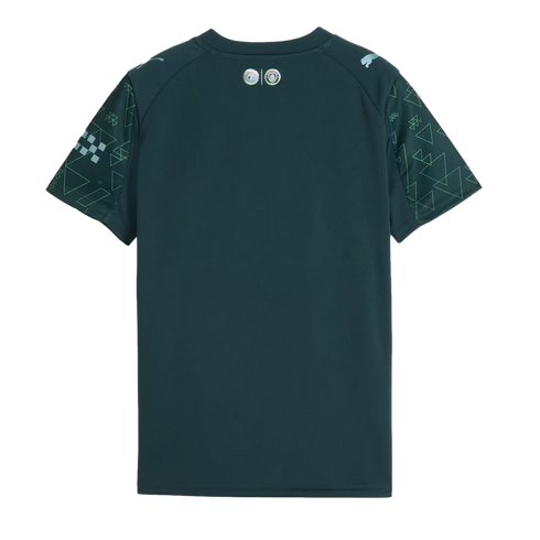 Back view of a dark teal Puma soccer jersey featuring lime green geometric patterns on short sleeves and small silver logos on the upper back neck.