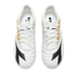 Top-down view of a pair of white Diadora sneakers with black and gold detailing and white laces, set against a solid black background.