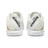 Rear view of a pair of white Diadora tennis shoes with gold side accents against a black background. The brand logo is featured on the mesh heels and white midsoles.