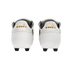Rear view of white Diadora soccer cleats with gold logos on the heels, set against a solid black background.
