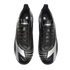 Top-down view of black Diadora soccer cleats featuring silver accents and branding, isolated on a black background.