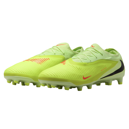 A pair of neon yellow Nike soccer cleats with orange and black swooshes, shown against a black background.