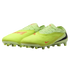 A pair of neon yellow Nike soccer cleats with orange and black swooshes, shown against a black background.
