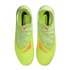 Top-down view of neon yellow Nike Phantom soccer cleats with orange accents on a black background.