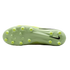The light green soleplate of a Nike soccer cleat with yellow conical studs, shown against a black background.