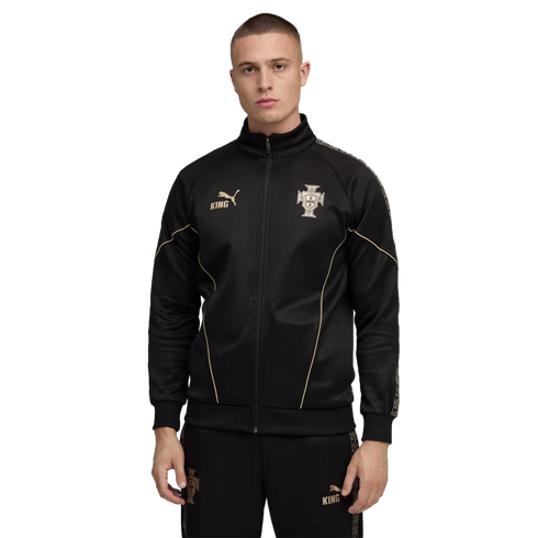 Man wearing a black Puma tracksuit with gold accents and Portugal national team crest, standing against a solid black background.