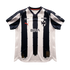 C.F. Monterrey home soccer jersey featuring navy blue and white brush-stroke stripes, red Puma logo, BBVA sponsor, and an 80th-anniversary patch.