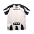 Back of a white and navy blue Puma Rayados soccer jersey featuring brush-stroke stripes and sponsor logos for OXXO GAS and H-E-B.