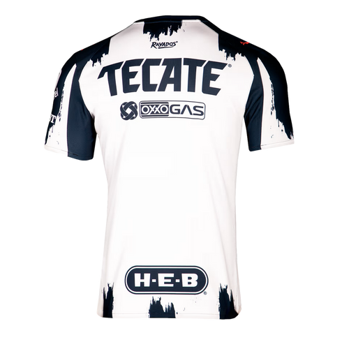 Back view of a white and navy Rayados soccer jersey with Tecate, Oxxo Gas, and H-E-B logos and a brushstroke pattern along the edges.