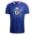 Blue Japan national football team jersey featuring a light blue radiating line pattern, a white Adidas logo, and the JFA crest. Includes white shoulder stripes and red collar trim.