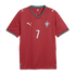 Red Portugal national team soccer jersey by Puma with white number 7, horizontal wavy patterns, and teal trim on the collar and sleeve cuffs.
