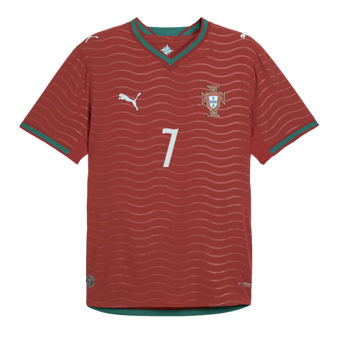 Portugal national team red soccer jersey by Puma, featuring a white number 7, the team crest, and green trim on the v-neck collar and sleeve cuffs.