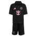 Inter Miami CF youth soccer kit in black with pink accents. Includes a polo jersey with Adidas, Royal Caribbean, and team logos, and matching shorts featuring a team crest.