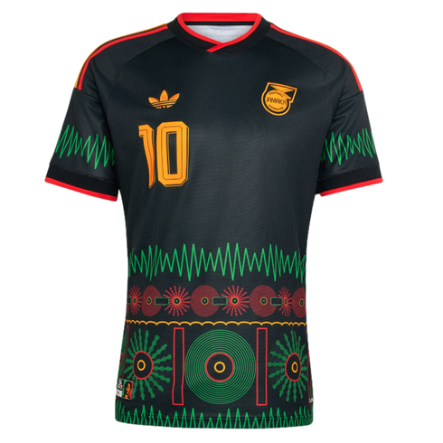 Black Adidas Jamaica soccer jersey with gold number 10, green zigzag accents, and colorful cultural graphics on the lower half.