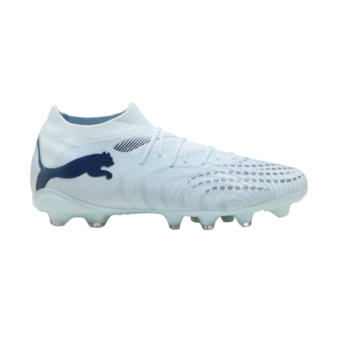 A white Puma soccer cleat with light blue accents and a dark blue logo, shown in profile against a black background.