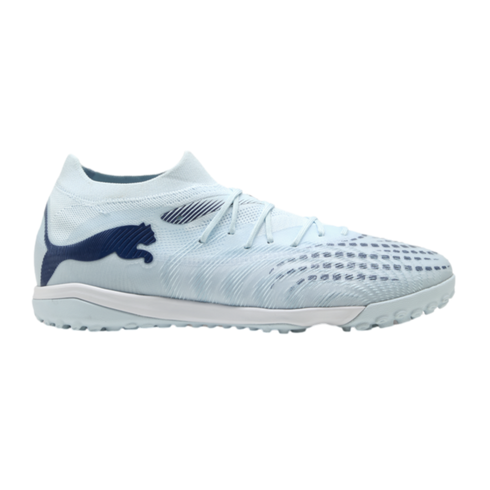 Light blue Puma turf soccer shoe with dark blue logo and accents, featuring a textured upper and white midsole, set against a black background.