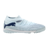Light blue Puma turf soccer shoe with dark blue logo and accents, featuring a textured upper and white midsole, set against a black background.