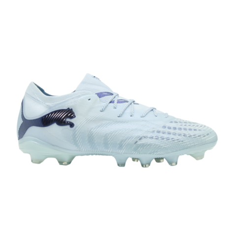 A light blue Puma soccer cleat with an iridescent dark blue Puma logo and matching accents, displayed against a solid black background.