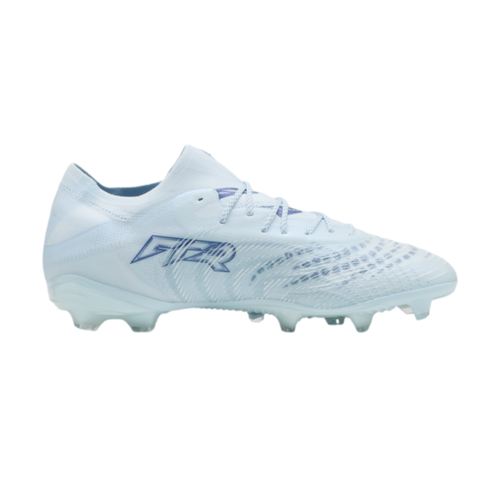 Side profile of a light blue textured soccer cleat with blue branding on the side, displayed against a solid black background.