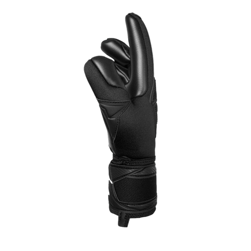 Side view of a black goalkeeper glove with padded fingers and a wrist strap against a black background.