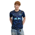 A man with red hair wearing a black and blue patterned Puma RB Leipzig soccer jersey and light blue jeans.