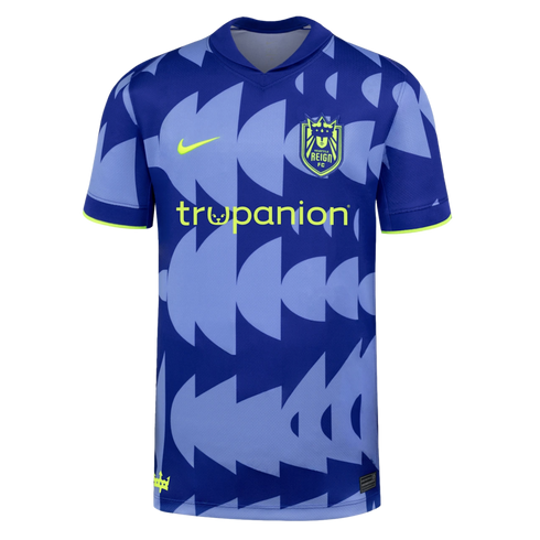 Seattle Reign FC soccer jersey with a blue geometric pattern, lime green Nike logo, team crest, and trupanion sponsor.