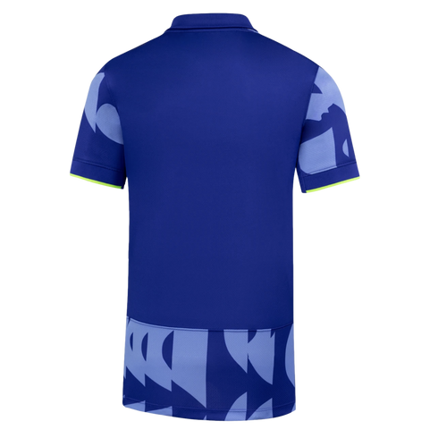 Back view of a royal blue polo shirt with light blue abstract patterns on the sleeves and bottom hem, accented by lime green trim on the cuffs.