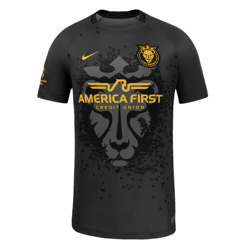 Black Utah Royals FC soccer jersey with gold Nike and sponsor logos. Features a large grey lion head graphic surrounded by a swarm of black bees.