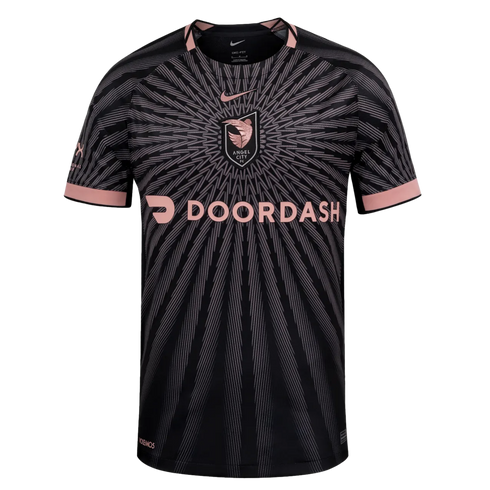 Nike Angel City FC jersey in black with a pink sunburst pattern, featuring the team's shield and DoorDash sponsor logo on the chest.