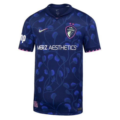 Dark blue Nike NC Courage soccer jersey featuring a light blue Venus flytrap floral pattern, a white Merz Aesthetics sponsor logo, and pink trim on the cuffs.