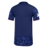 The back of a navy blue polo shirt with blue floral patterns on the sleeves and bottom panel, featuring pink scalloped trim on the sleeve cuffs.
