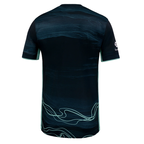 Back view of a dark teal athletic jersey featuring light teal marble-like patterns and wavy line accents on the lower back.