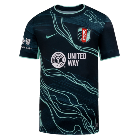 Kansas City Current dark teal soccer jersey featuring light green flowing lines, a white United Way sponsor logo, Nike swoosh, and team crest.