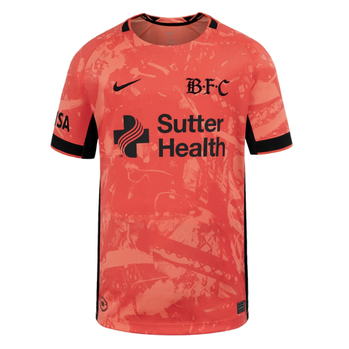 Coral pink Nike soccer jersey with an abstract pattern, featuring a black BFC crest and Sutter Health sponsor logo.