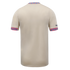 The back of a cream-colored short-sleeved jersey with vibrant pink and blue floral patterns on the collar and sleeve cuffs.