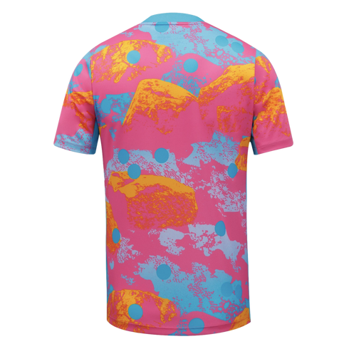 Back view of a vibrant short-sleeved T-shirt with an abstract pattern of pink, blue, orange, and yellow shapes, accented with light blue polka dots.