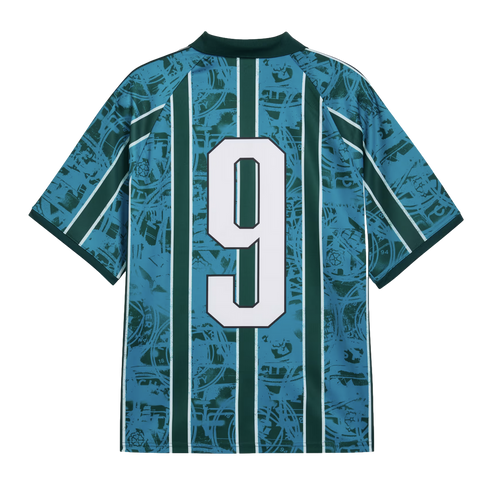 The back of a teal and dark green striped soccer jersey featuring a large white number 9. The jersey has an intricate graphic pattern overlaid across the entire fabric.