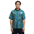 Man wearing a teal and dark green patterned Manchester City soccer jersey with vertical stripes, posed against a plain black background.