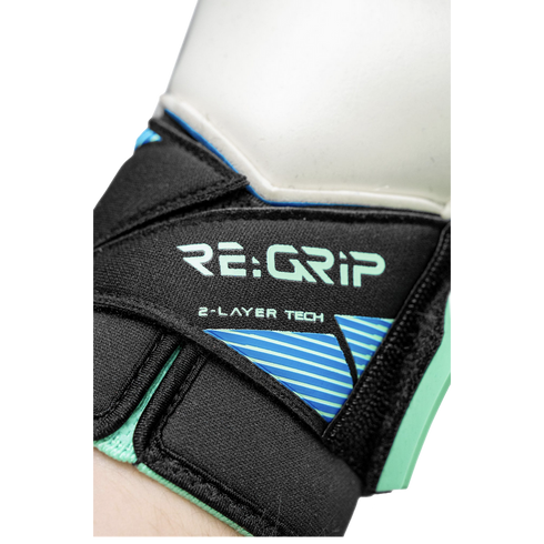 Close-up of a goalkeeper glove's black wrist strap with "RE:GRIP" and "2-LAYER TECH" printed in light green above a blue striped graphic.