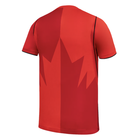 The back of a red Canada national team sports jersey with a vertical two-tone design and a large, stylized maple leaf graphic in the center, set against a black background.